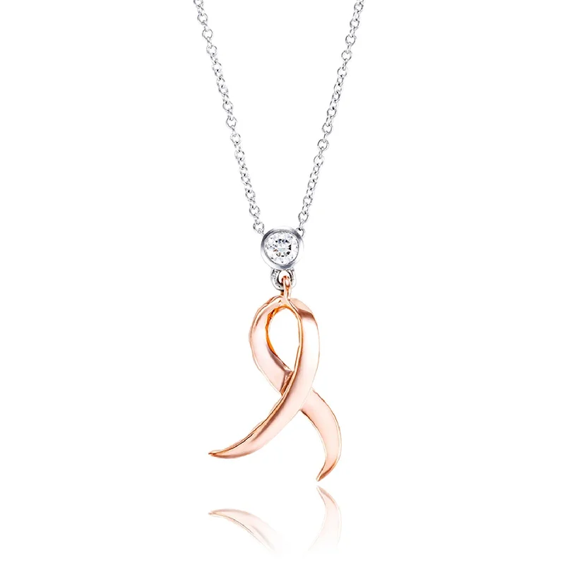 Shining Strength Diamond Pendant 14 karat rose and white gold  .11ct diamond  18" white gold chain